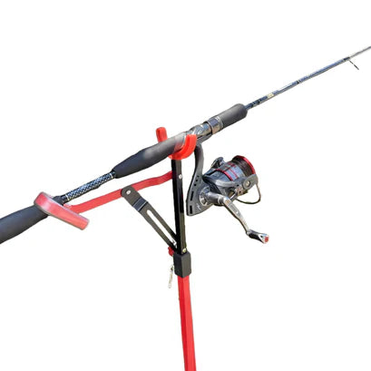 Fishing rod and reel on a stand against a white background